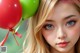 A girl with blue eyes holding a bunch of red and green balloons.